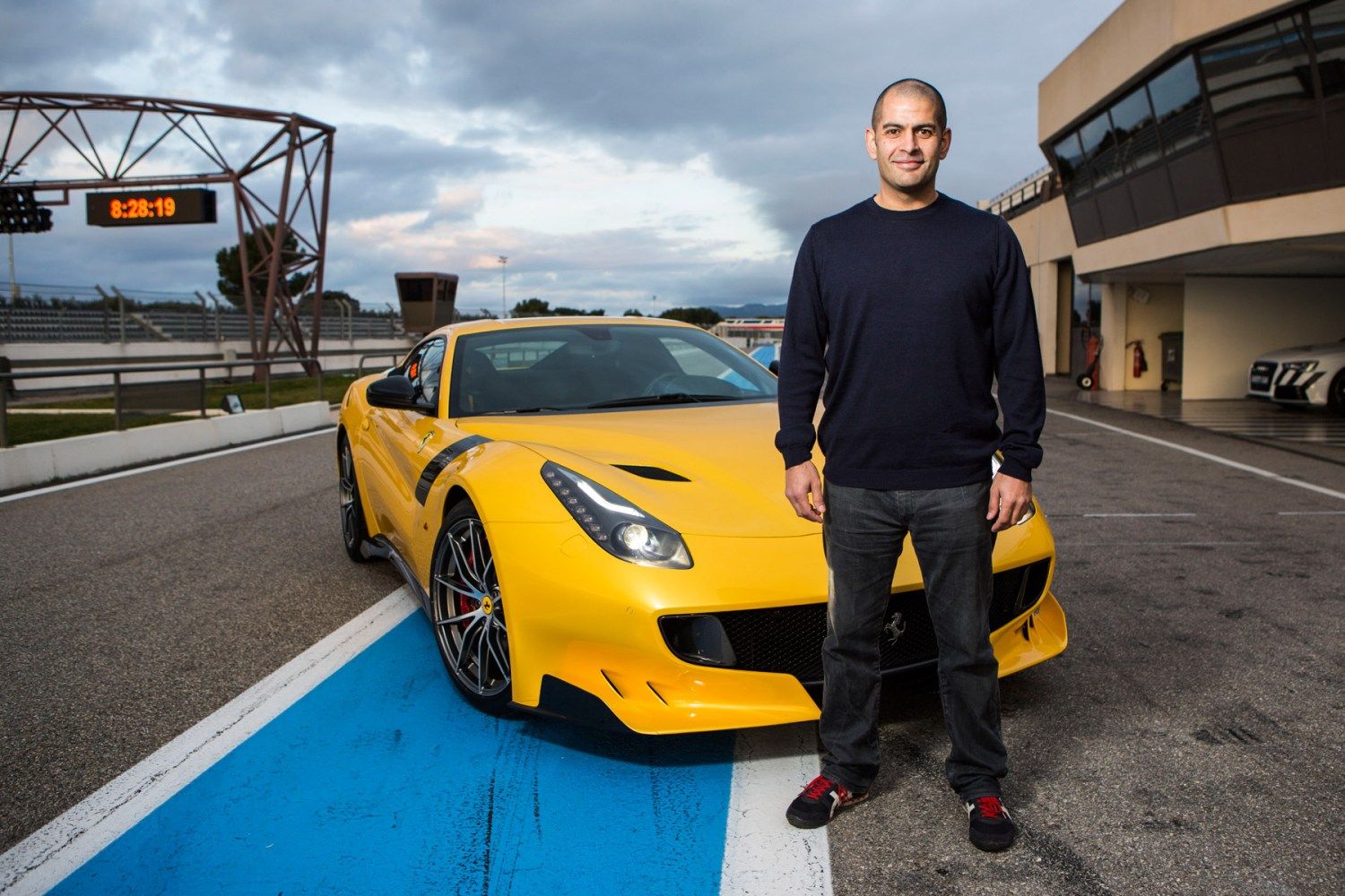 <img src="chris-harris.jpg" alt="Chris Harris stands in front of a Ferrari">