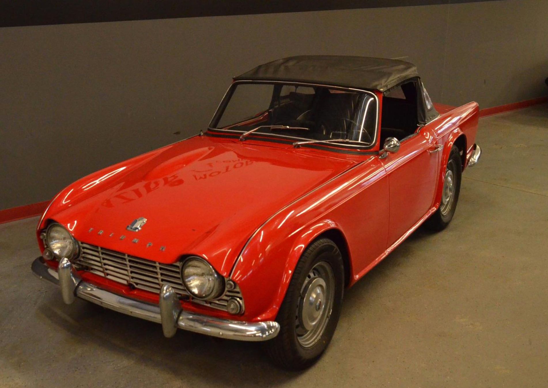 <img src="1970-triumph-tr4.jpg" alt="The front three quarters of a 1970 Triumph TR4">