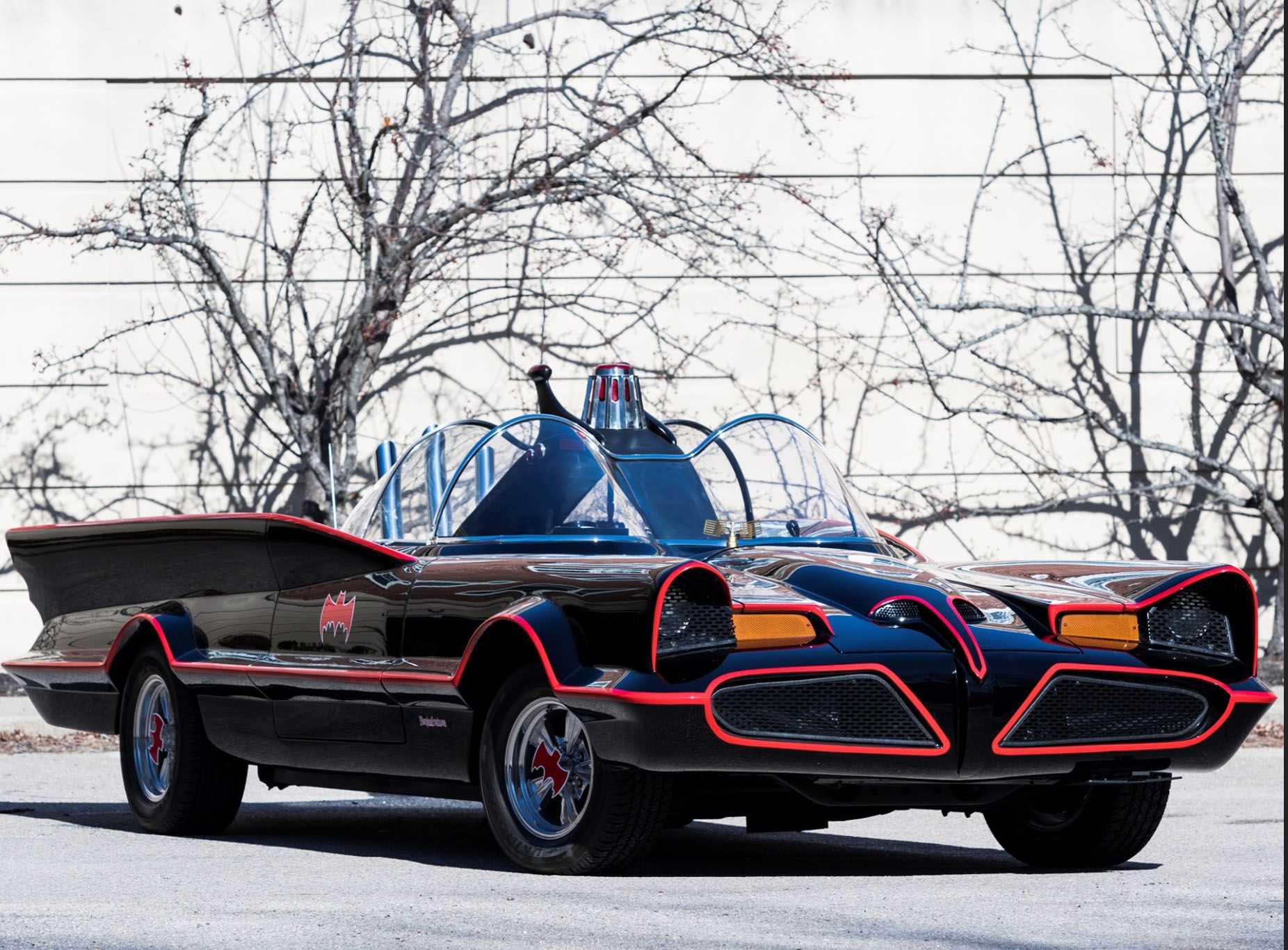 <img src="1966-batmobile-front-three-quarters.jpg" alt="A 1966 Batmobile replica up for bids">