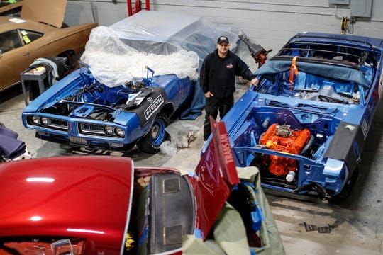 <img src="dave-dudek.jpg" alt="Restoration expert Dave Dudek stands among some of his muscle car projects">