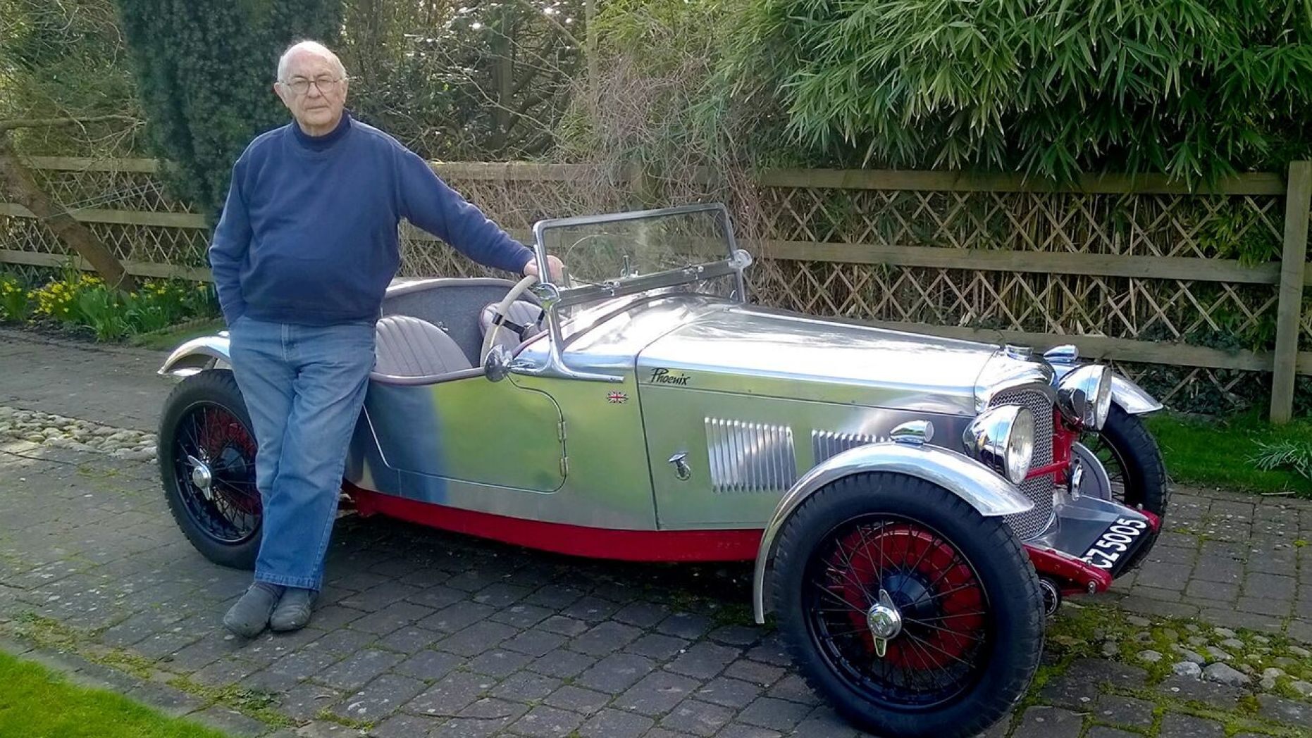 <img src="phoenix-fire-4.jpg" alt="Roger Fountain stands in front of "Phoenix", his beloved Riley sports car destroyed by a fire">