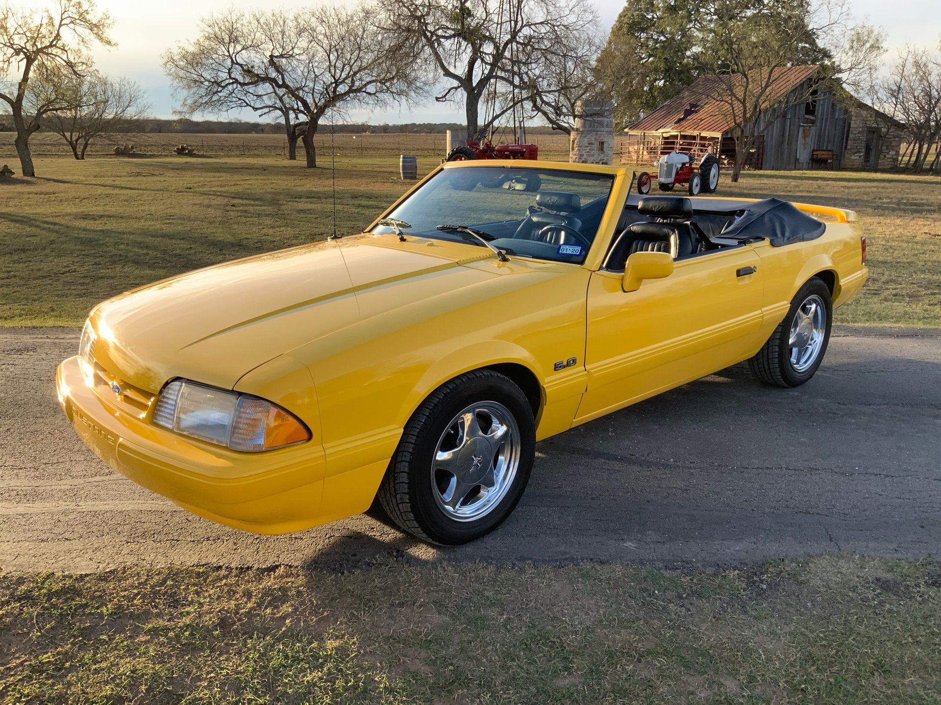 <img src="1993-ford-mustang-feature.jpg" alt="A rare 1993 Ford Mustang LX convertible feature car in Canary Yellow">