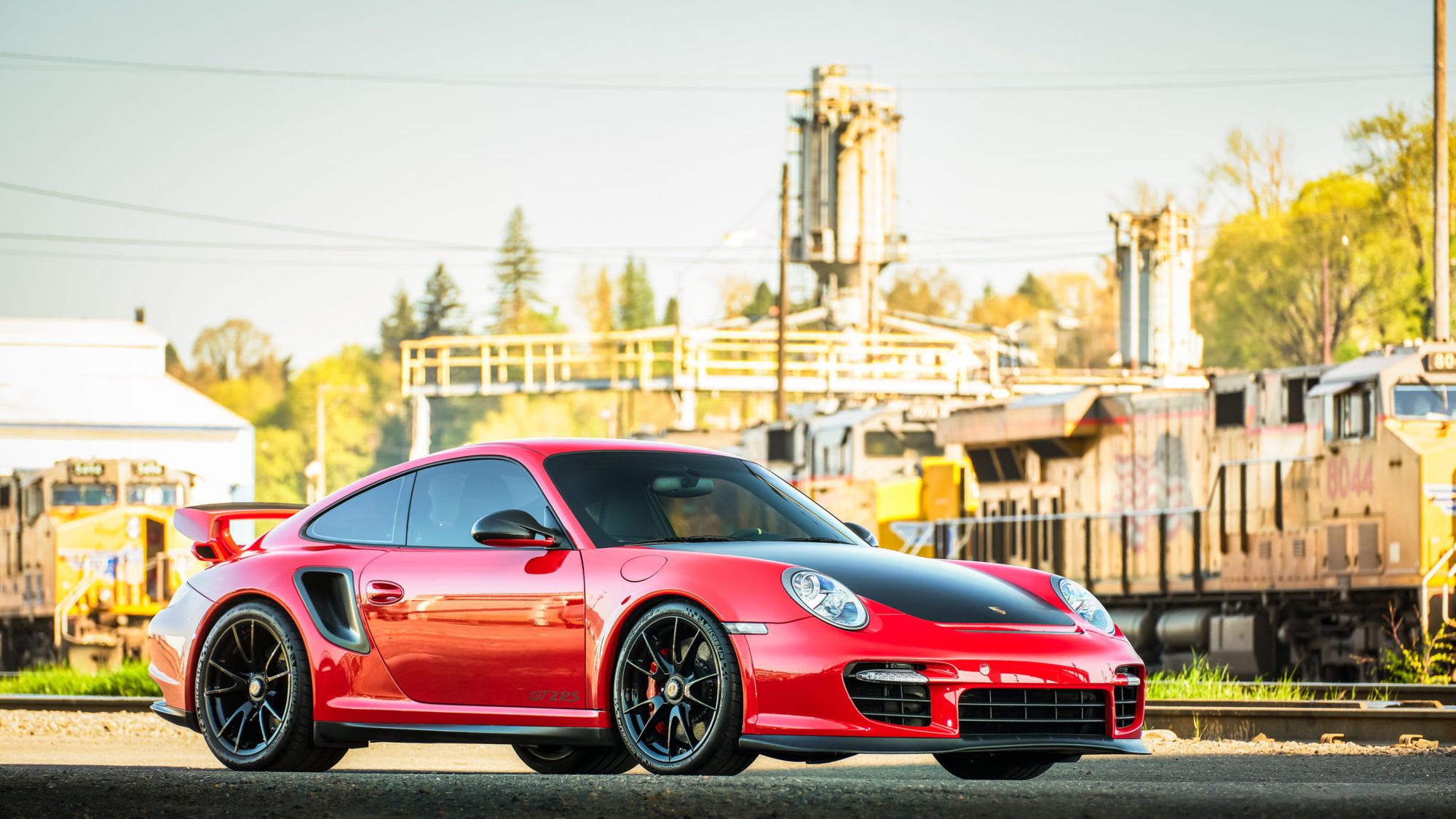 <img src="2011-porsche-911-gt2-rs-2.jpeg" alt="A rare 2011 Porsche 911 GT2 RS in Guards Red">