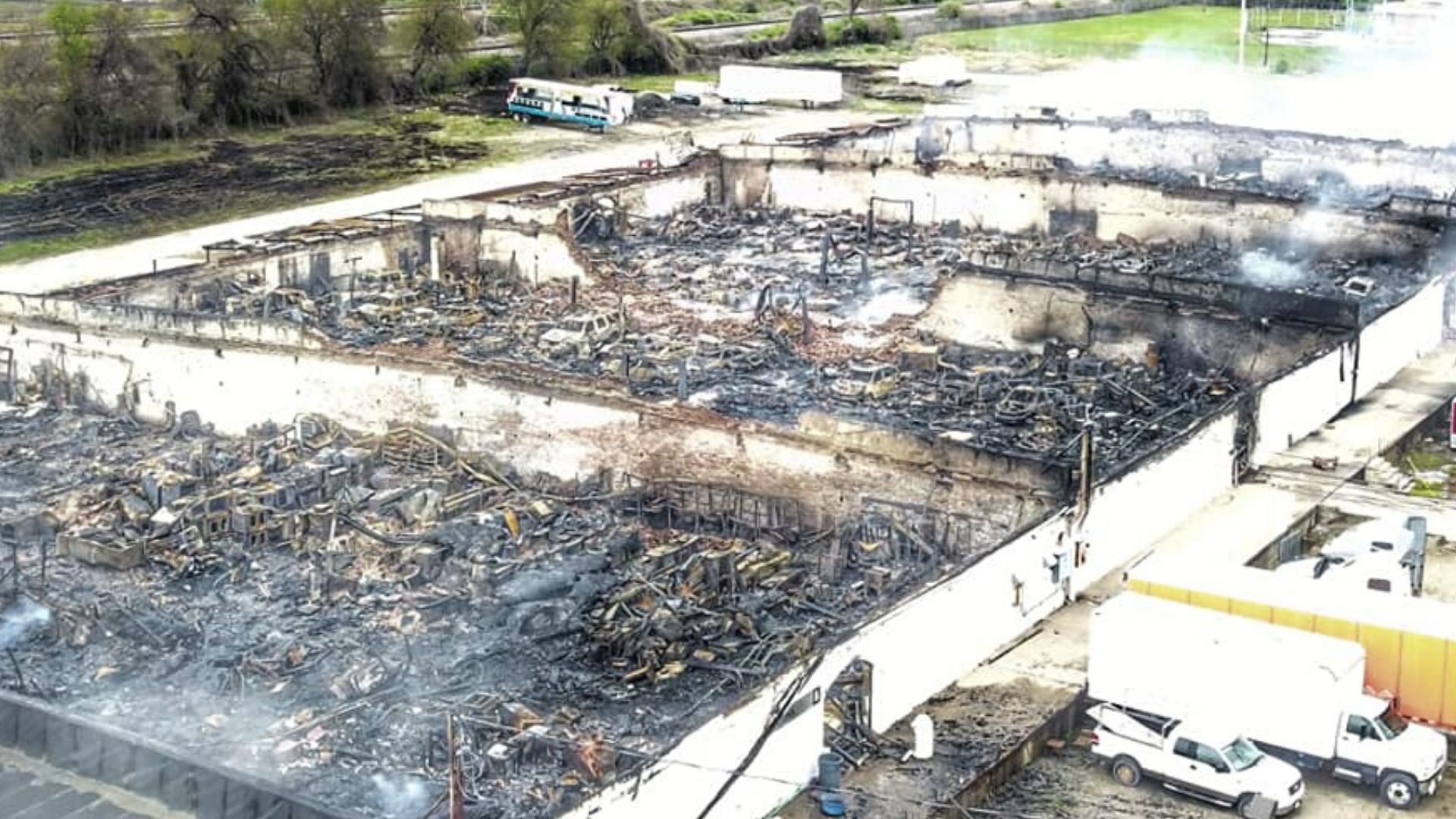 Fire Ravages Warehouse Complex Packed With Cars