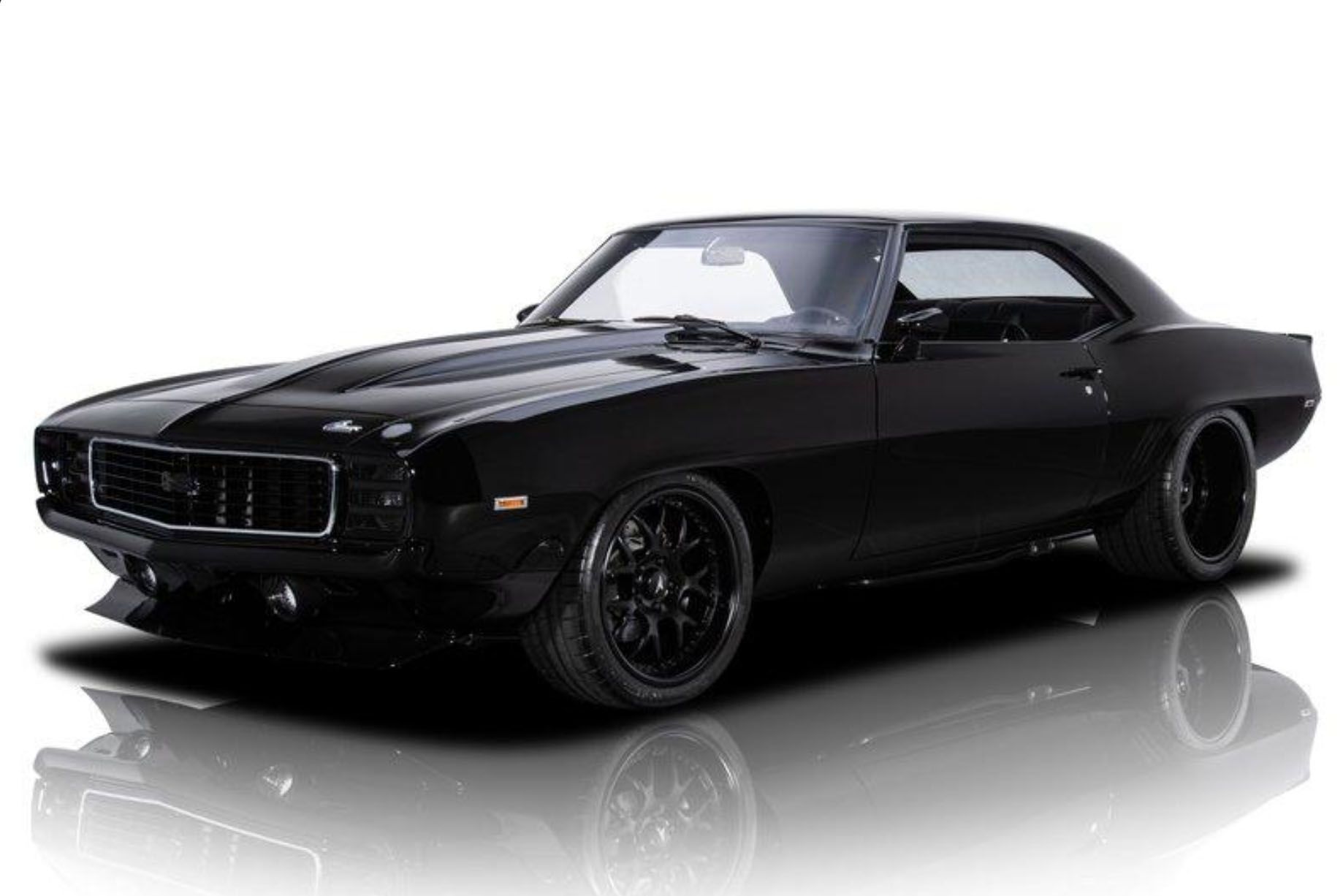 <img src="auction-1969-camaro-restomod.jpg" alt="A sinister 1969 Chevrolet Camaro Restomod powered by a supercharged LSA V8 engine">