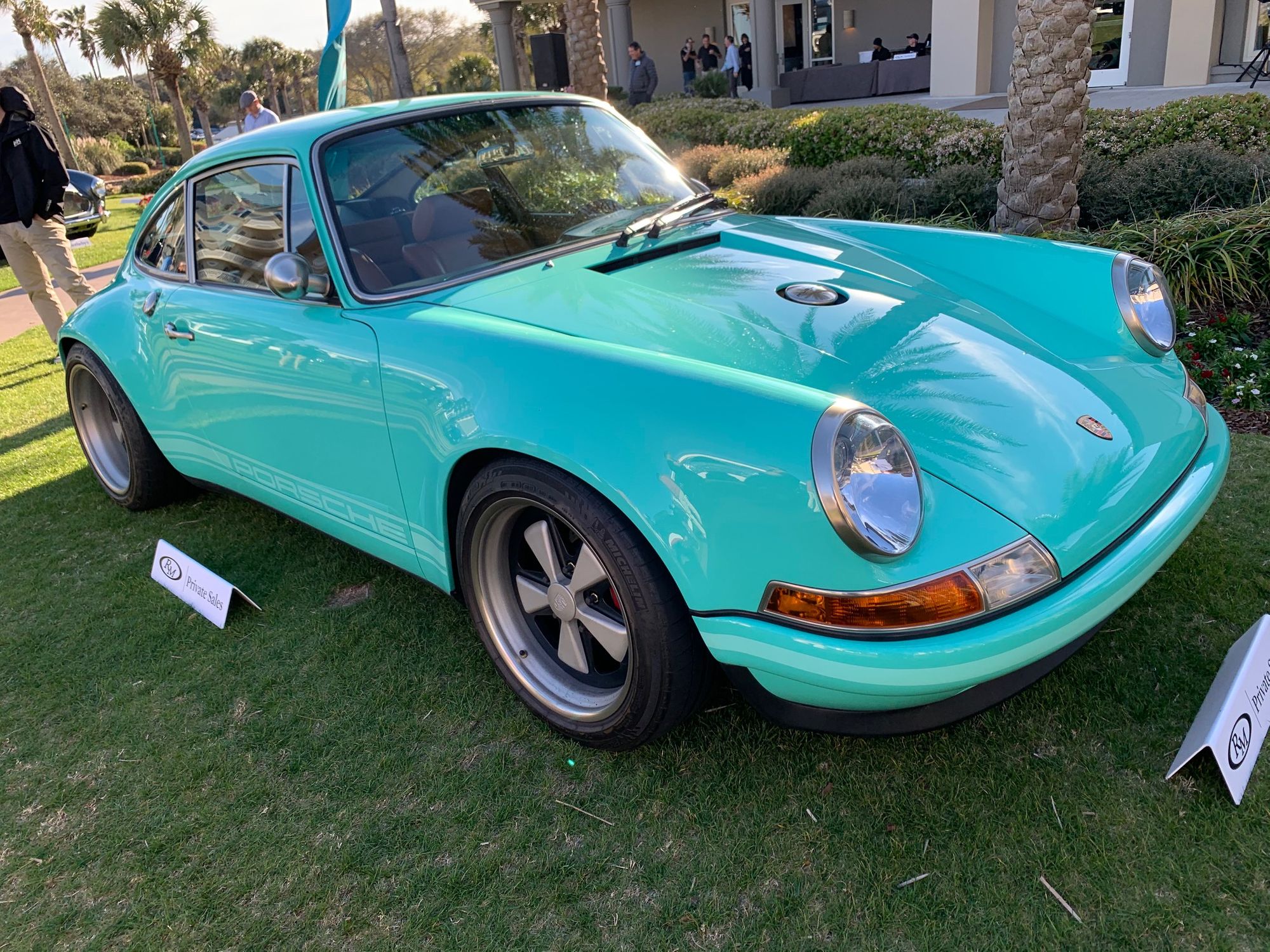 <img src="classic-porsche.jpg" alt="A classic Porsche at the Amelia Island Concours d'Elegance">