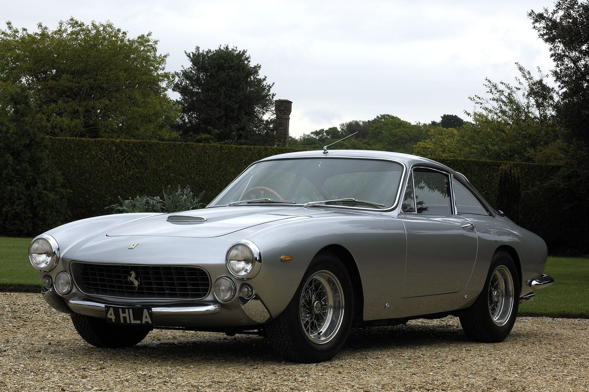 <img src="ferrari-250-gt-lusso.jpg" alt="A 1964 Ferrari 250 GT Lusso also sits in Eric Clapton's collection">4