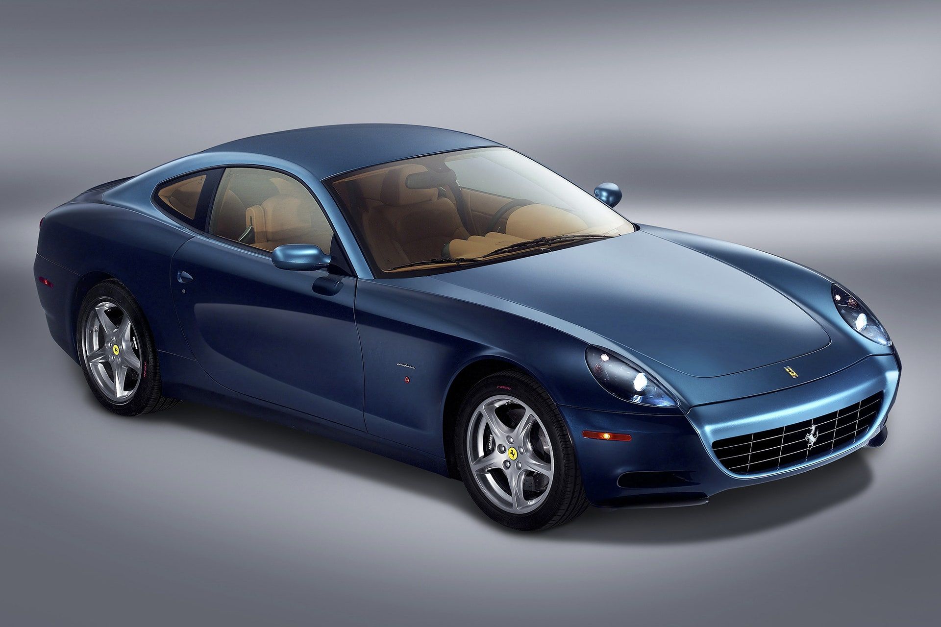 <img src="ferrari-612-scagietti.jpg" alt="A Ferrari 612 Scaglietti that sits in Eric Clapton's collection">