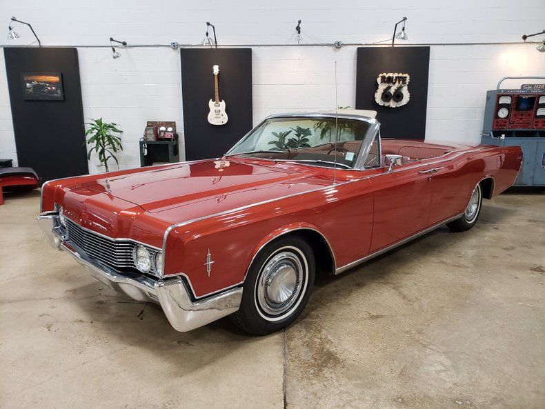 <img src="1966-lincoln-continental.jpeg" alt="A 1966 Lincoln Continental convertible">