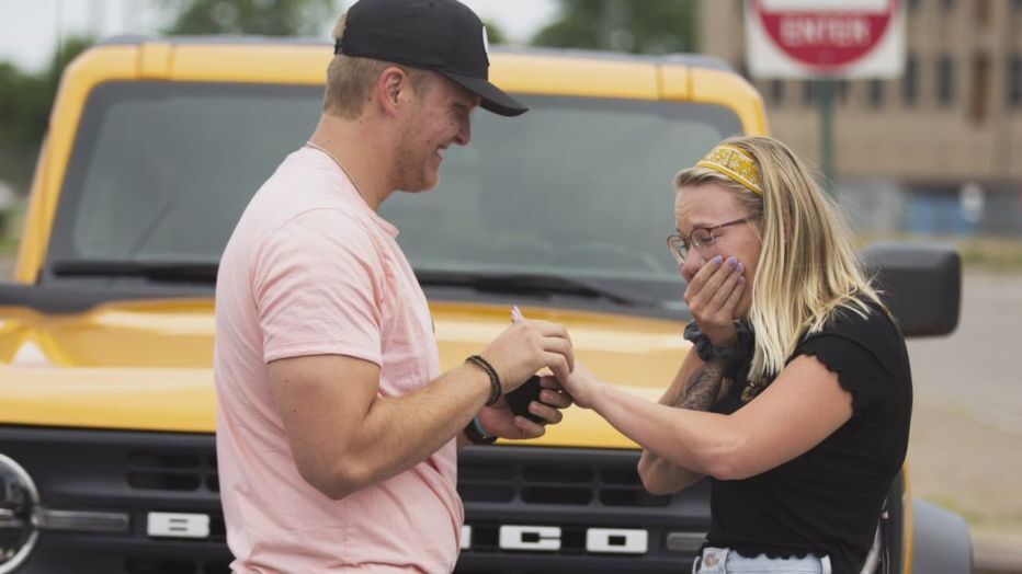 <img src="bronco-proposal.jpg" alt="A marriage proposal in front of the new Bronco">