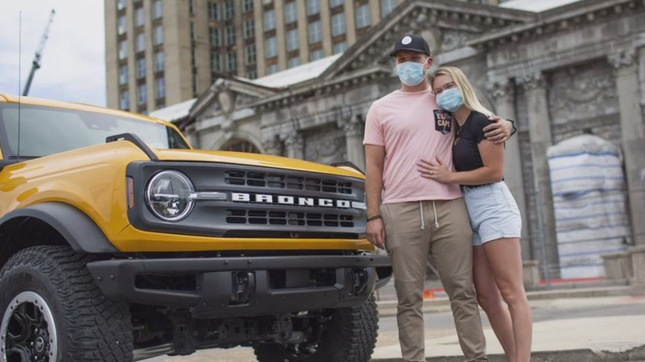 <img src="bronco-jpg" alt="A marriage proposal in front of the all-new 2021 Bronco prototype">