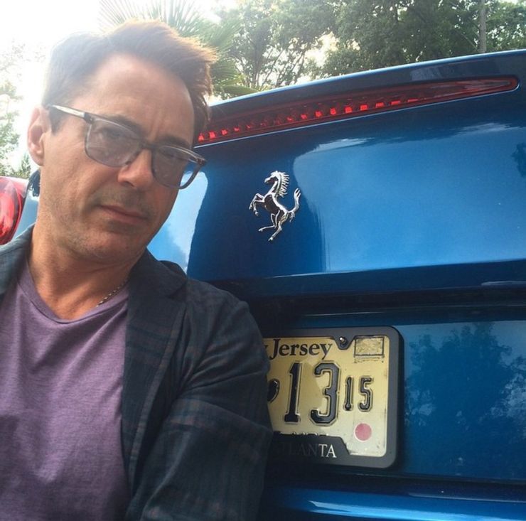 <img src="ironman.jpg" alt="Robert Downey, Jr., and his blue Ferrari California T">