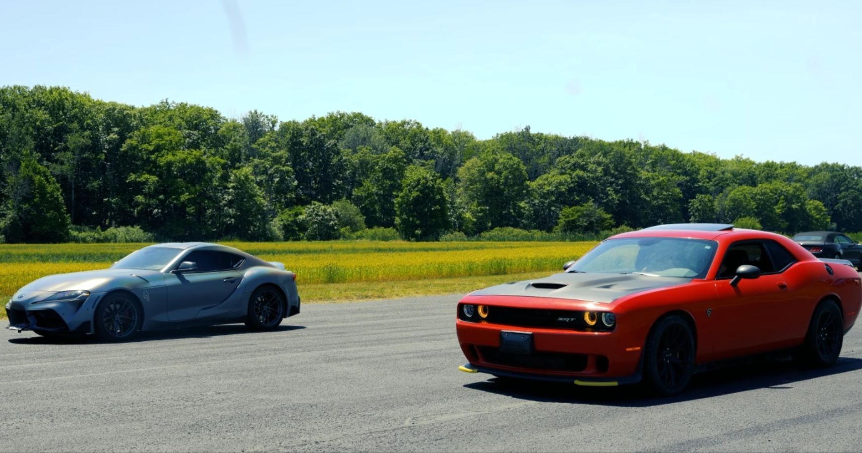 Tuned Supra Races Challenger Hellcat