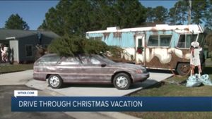Lawyer's Garage Car Display Spreads Christmas Cheer